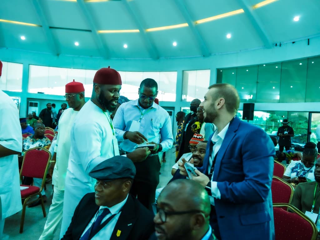 Delegates networking at a conference hall in Oji River